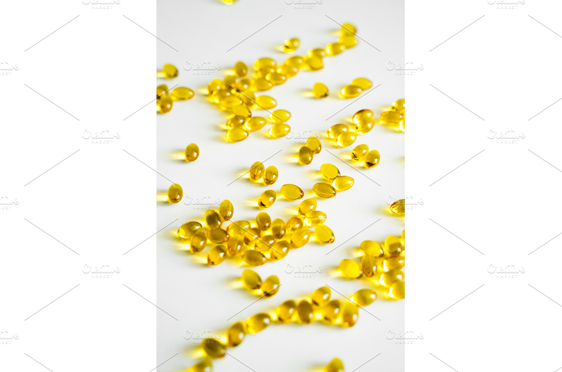 Bright yellow oval capsules, a Health & Medical Photo by volodymyrshtun13795