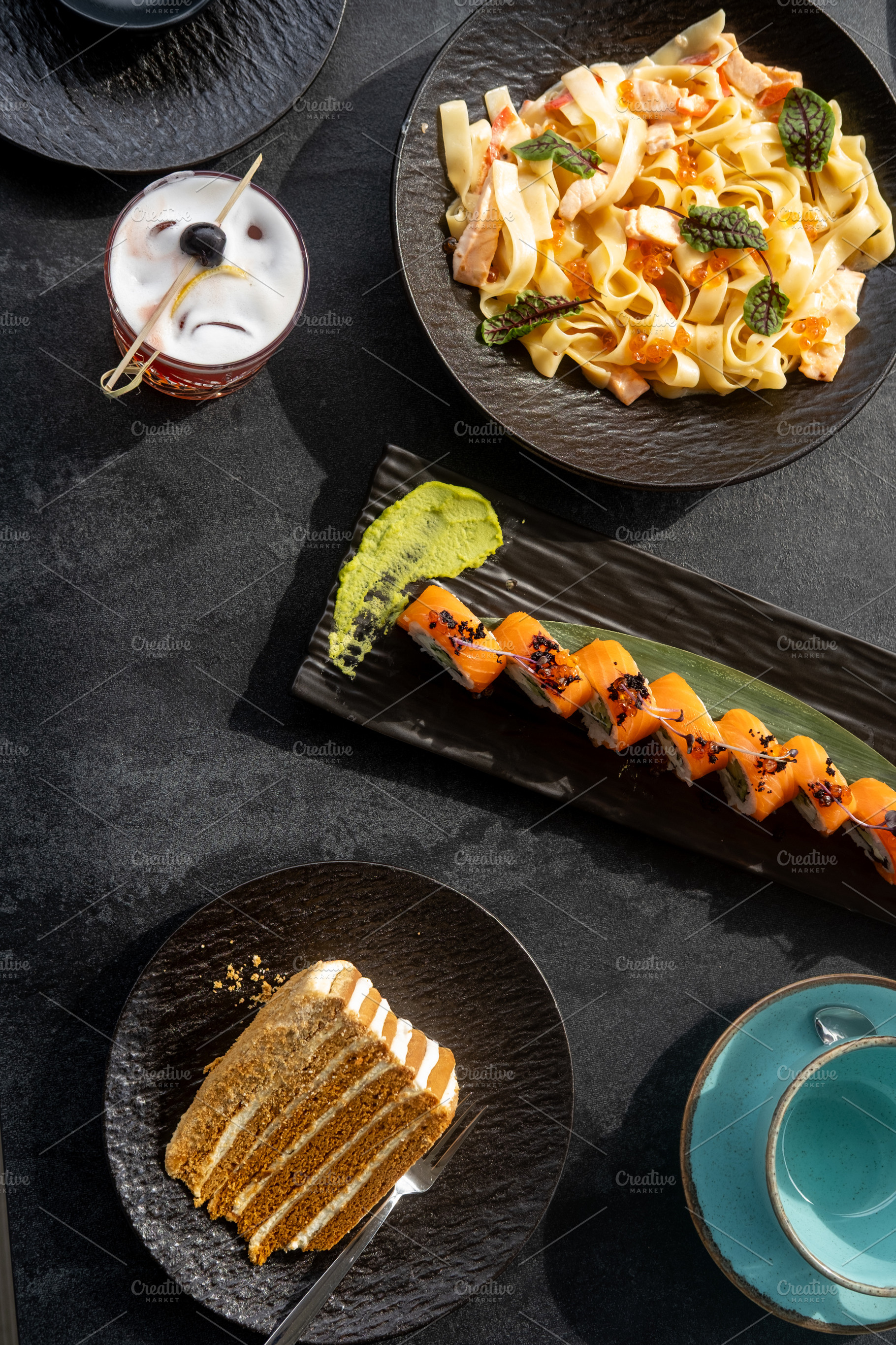 Assorted dishes food table served sushi cake cup, a Food & Drink Photo by Photo Drive Studio