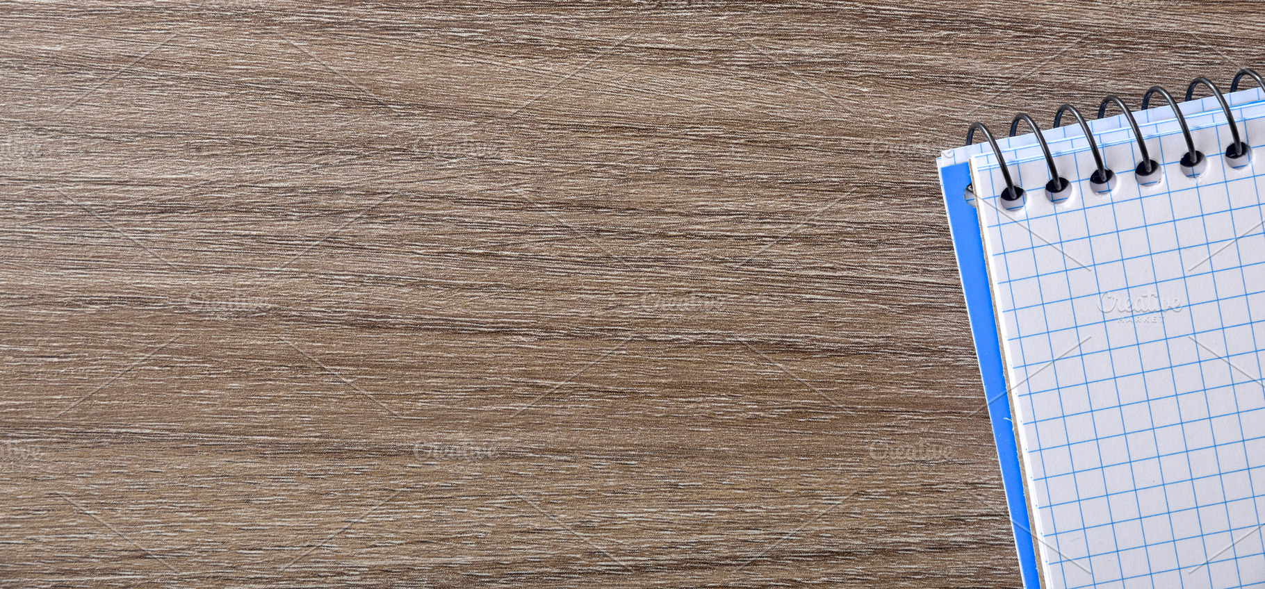 Spiral Notebook on Wooden Desk Corner, a Business Photo by Davizro's Market