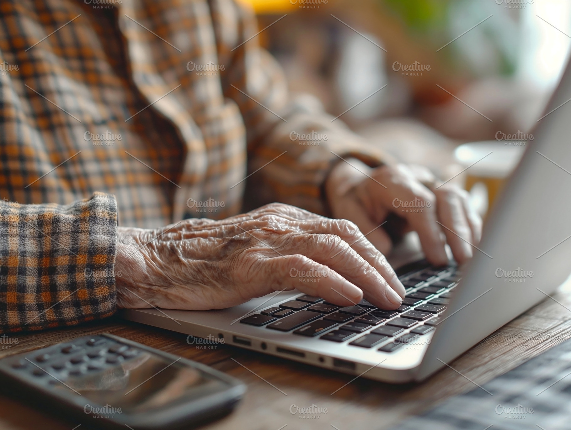 Close-up of an elderly person's hands typing on a laptop, conveying a sense of, a Person Photo by ImageMir