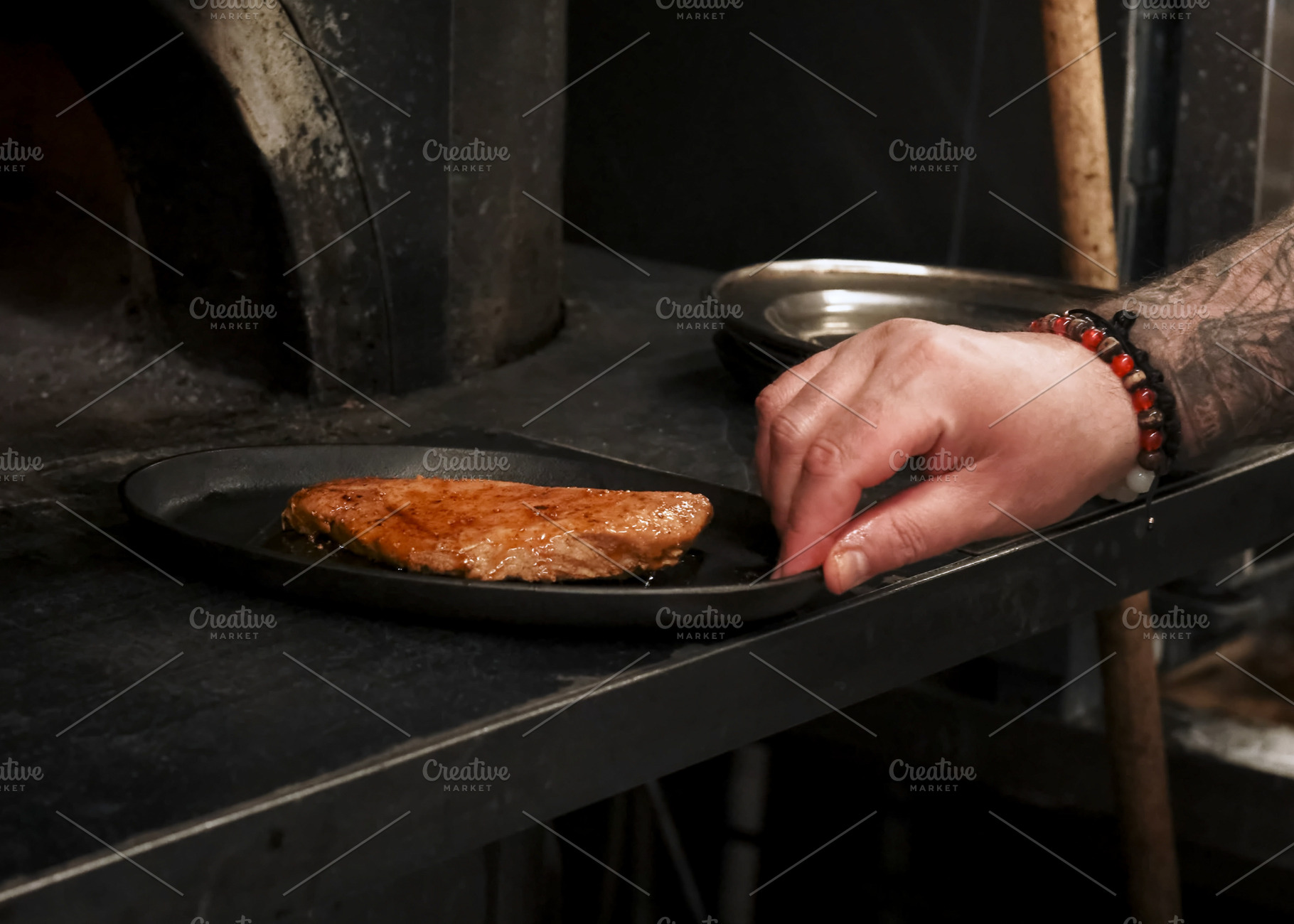 Oven cooking meal preparation chef pan steak meat, a Person Photo by Photo Drive Studio