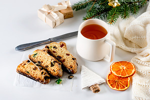 Traditional christmas german dessert fruitcake stollen cut into, a Food & Drink Photo by vimart