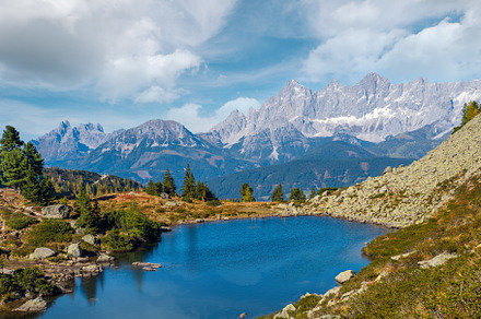 Calm autumn Alps mountain lake with clear transparent water and, a Nature Photo by YuriyB