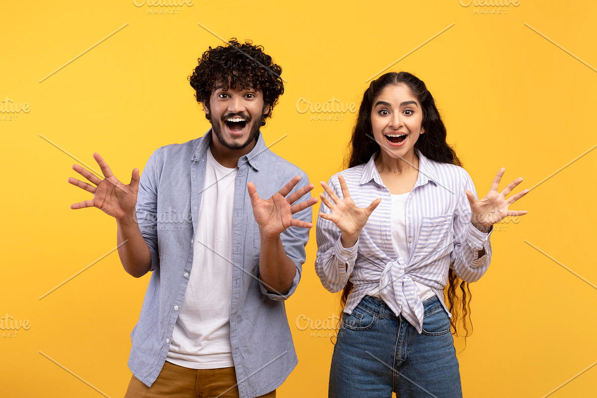 Emotional indian couple gesturing together, having surprised face expressions a, a Photo by Prostock-Studio (Photo 3 of 5)