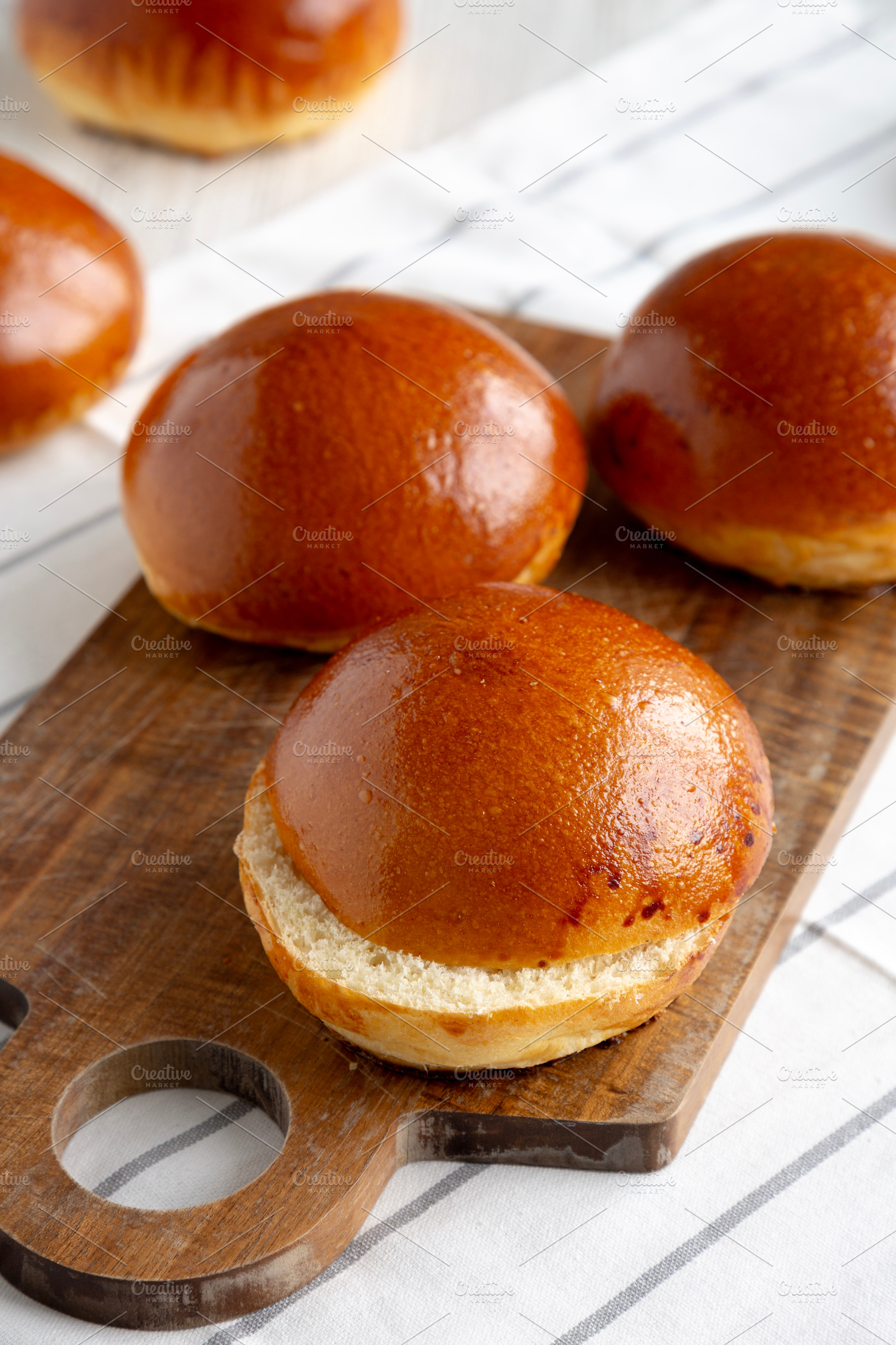Homemade Brioche Buns Ready to Eat, side view., a Food & Drink Photo by LiudmylaChuhunova