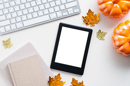 E book reader mockup on autumn desk, a Technology Photo by photoguns