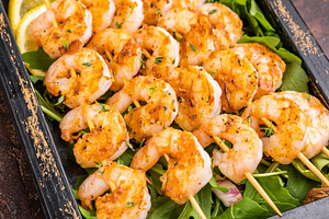 Grilled shrimp prawn skewers served in a rustic wooden box with, a Food & Drink Photo by composter-box@mail.ru