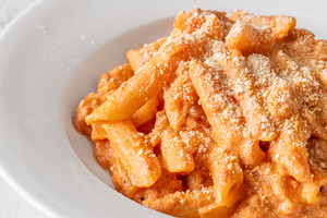 Penne pasta in creamy ricotta tomato, a Food & Drink Photo by Alexander Prokopenko