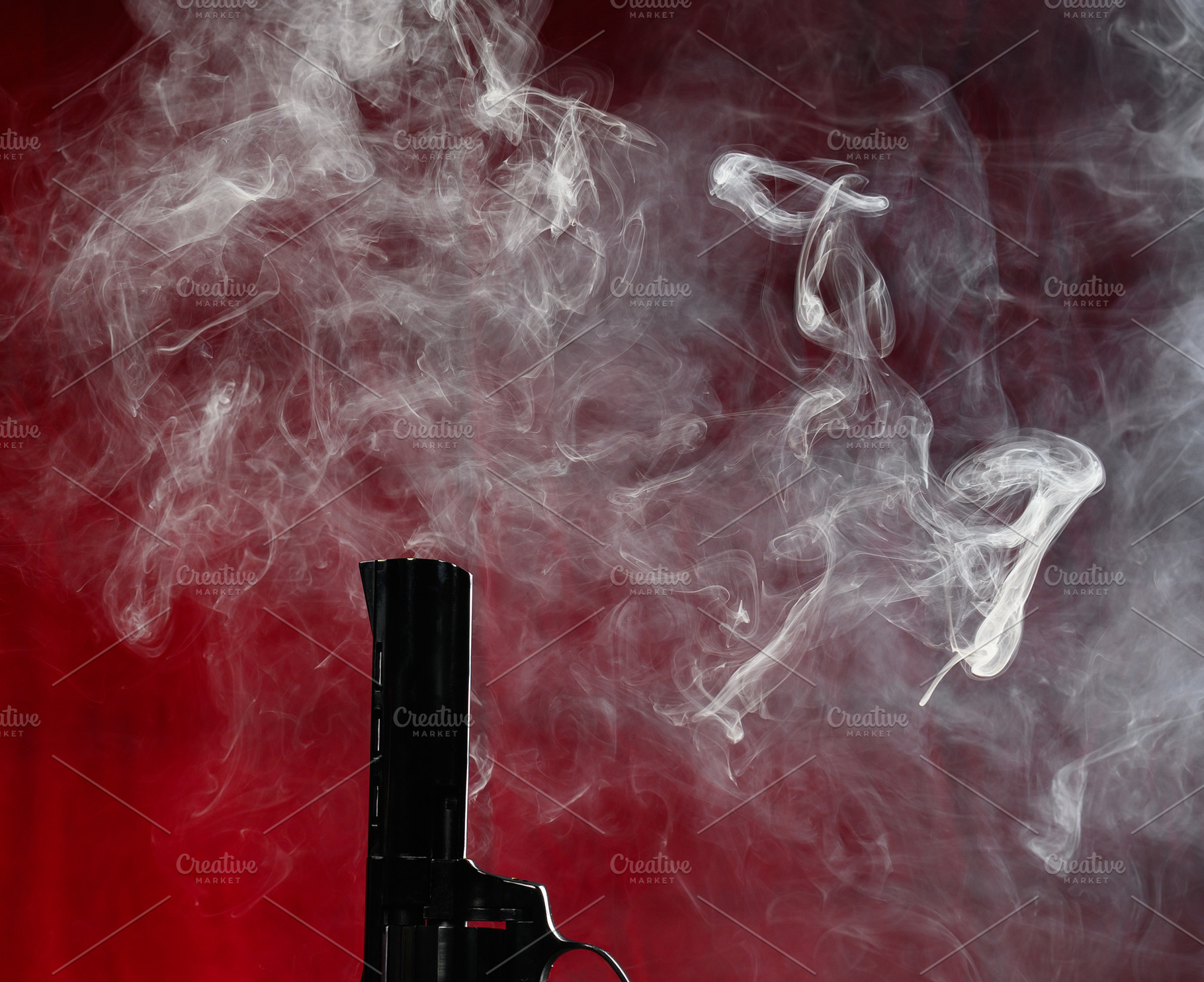 The barrel of a pistol from which thick, white smoke rises, form, a Background Photo by ndanko