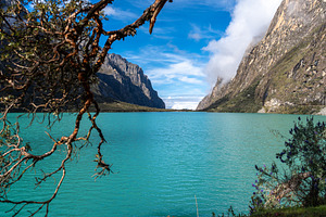 Turquoise lake surrounded by mountains on the Laguna 69 trek, Pe, a Nature Photo by GoodGoods