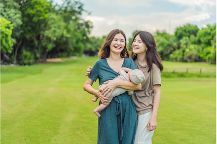 A happy 40-year-old mother cradles, a Person Photo by Elizaveta Galitskaya