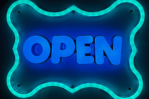 Bright neon sign displaying the text 'Open' with glowing blue lighting, a Photo by AS photostudio