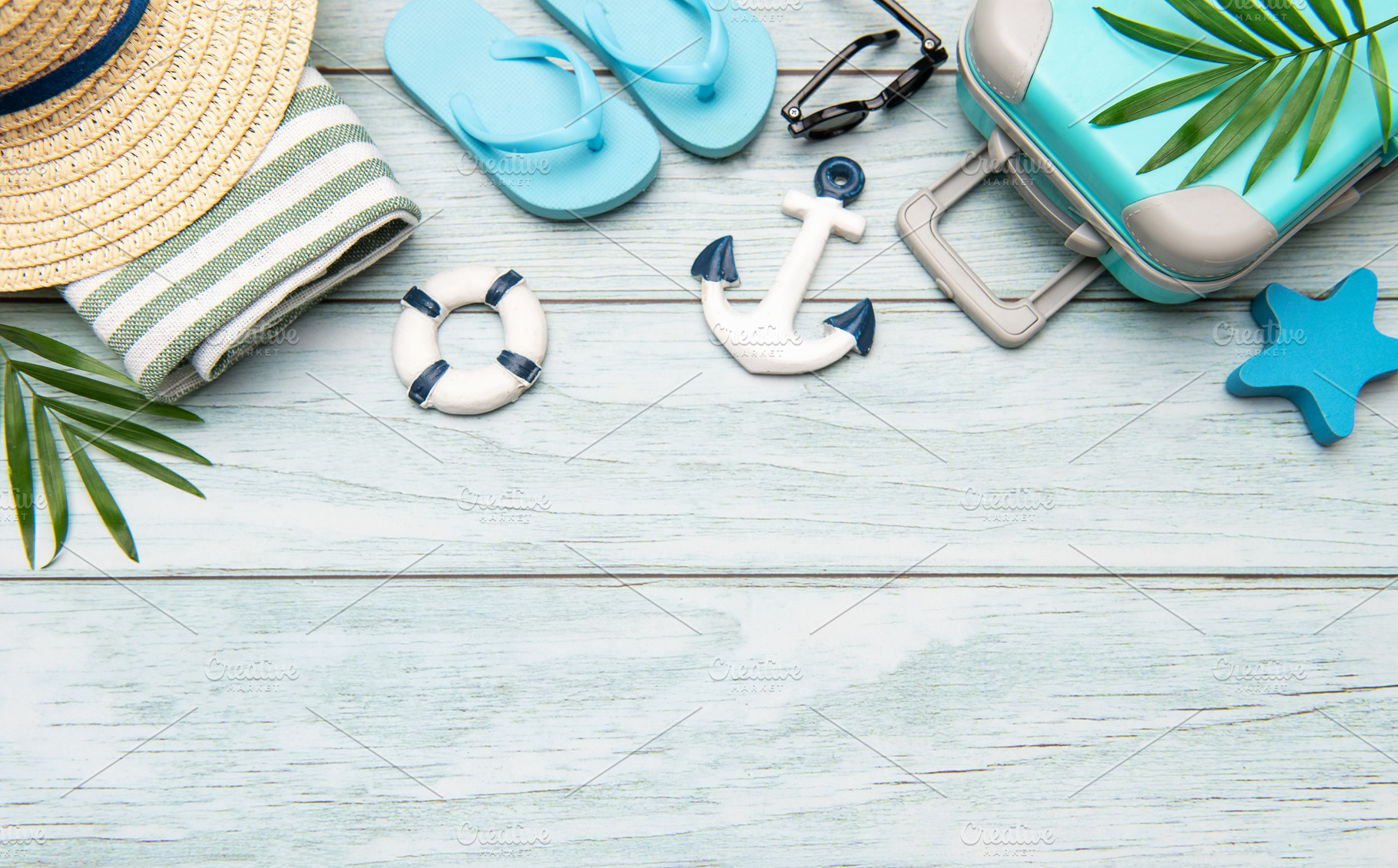 Summer vacation accessories lying on wooden background with copy, a Holiday Photo by Olena Rudo