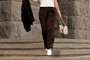 Young woman descending stone stairs, a Person Photo by Elena Vagengeim