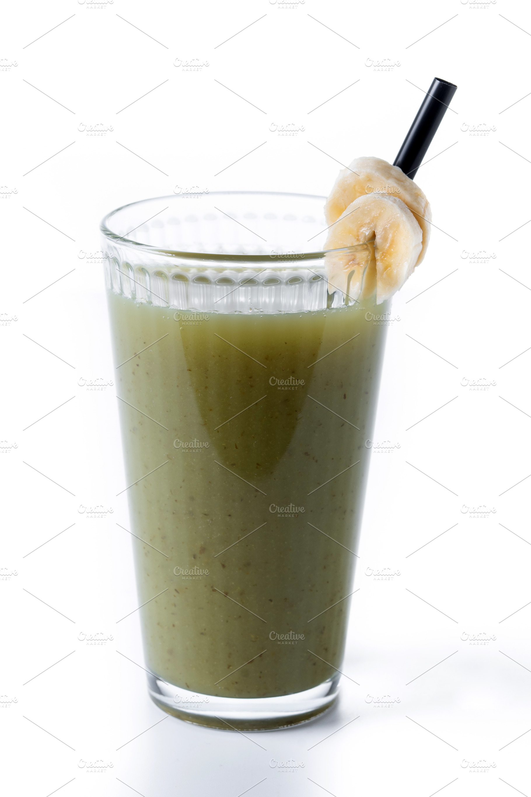 Green smoothie with spinach,banana, apple, and lemon isolated on white backgrou, a Food & Drink Photo by etorres69