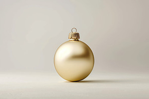 A single golden Christmas bauble iso, a Photo by LOGOCREATIVE