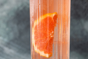 Refreshing pink Paloma cocktail with grapefruit ice bubbles and