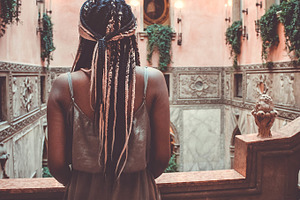Black Girl Looking Out Balcony