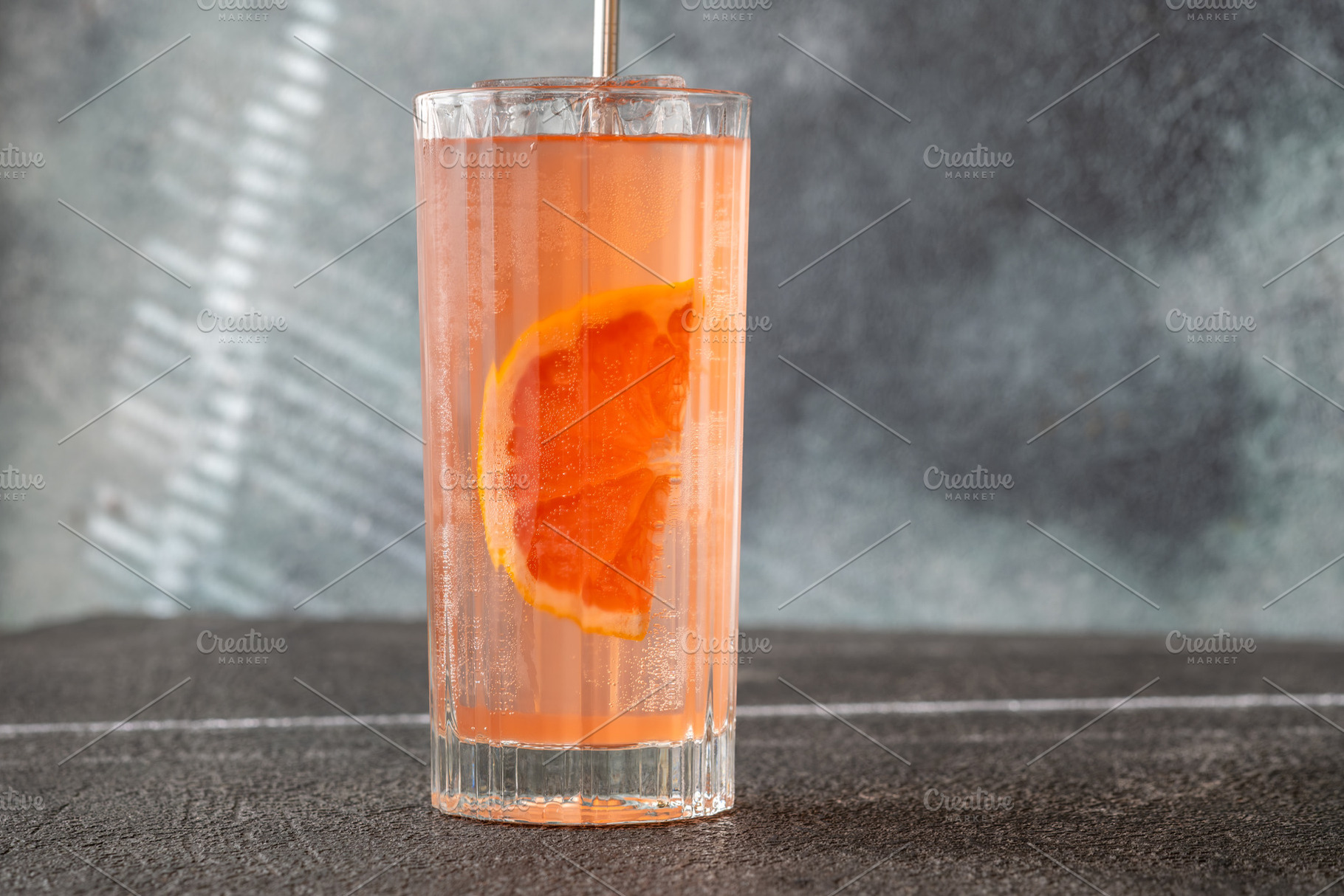 Refreshing pink Paloma cocktail with grapefruit ice bubbles and, a Food & Drink Photo by Alexander Prokopenko