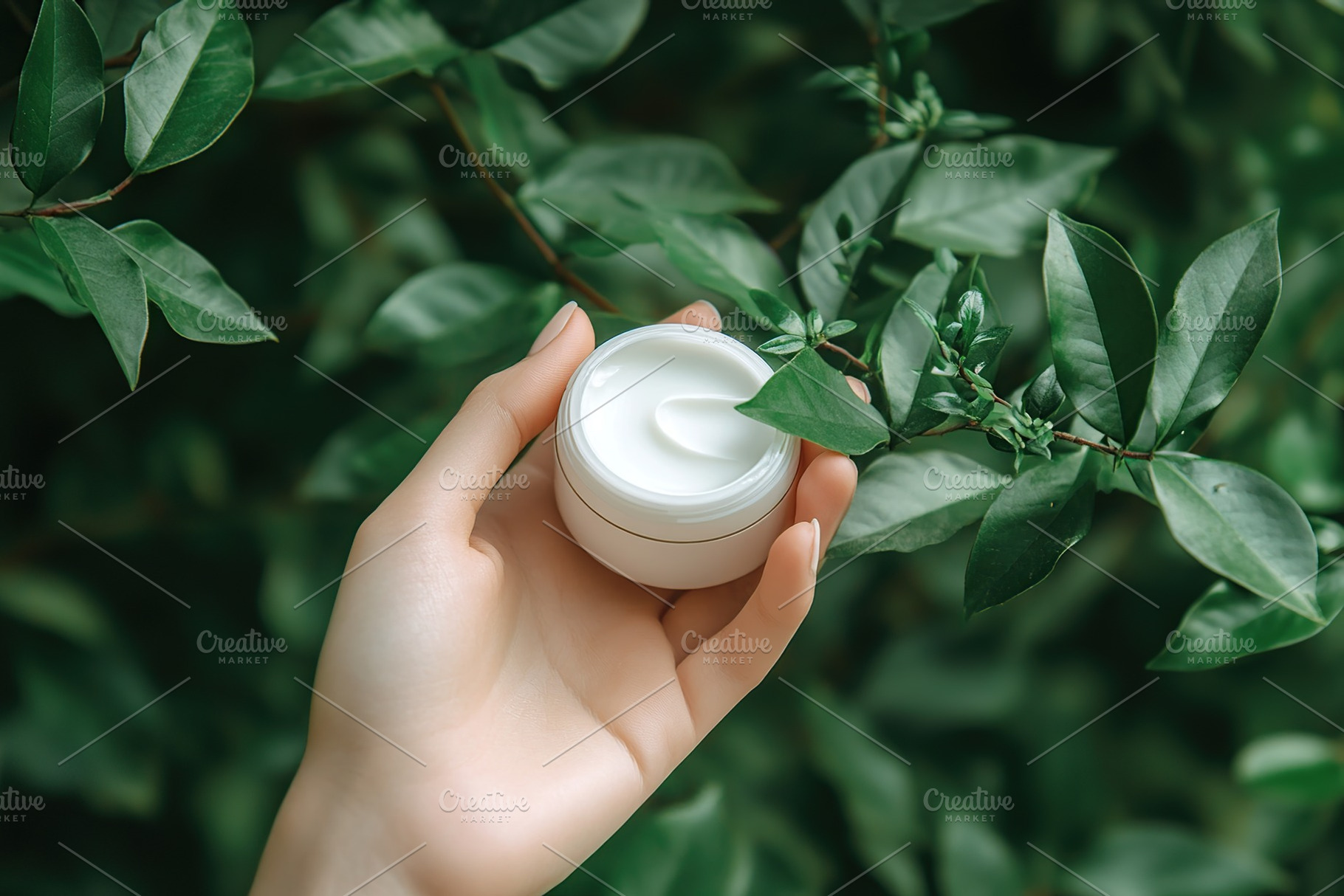 Female model hand holding cosmetic jar on green leaves background, a Beauty & Fashion Photo by AlyaAnd