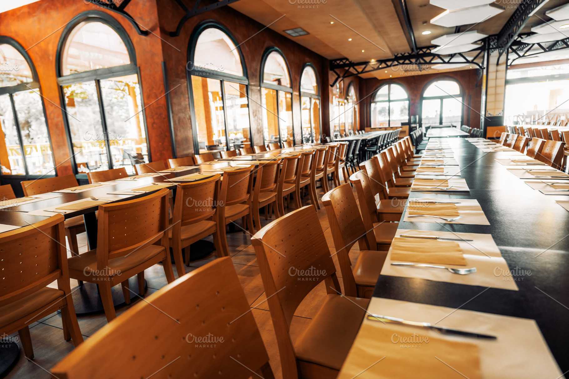Empty restaurant with tables set, a Food & Drink Photo by SkyNext