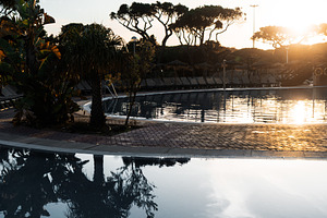 Sunrise poolside tropical calm scene, a Sports & Recreation Photo by SkyNext