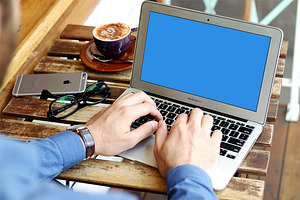 MacBook Air Mockup At Cafe