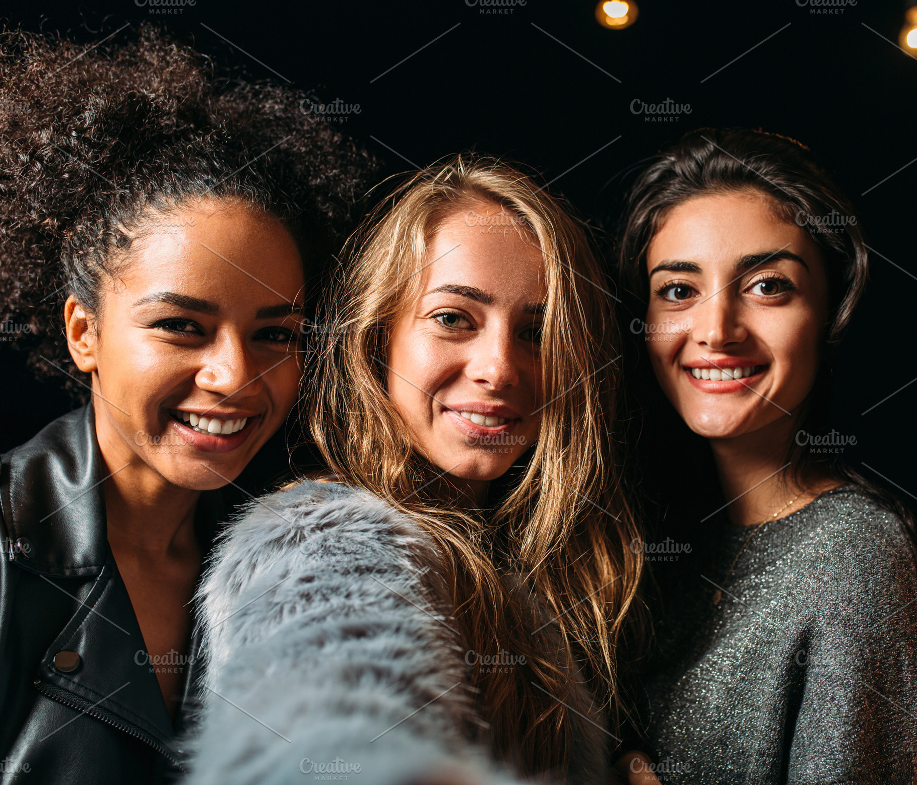 Three beautiful women taking selfie, a Person Photo by Artem Varnitsin