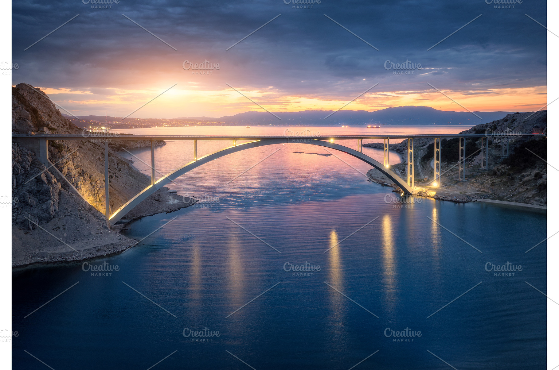 Bridge over the sea at sunset, an Architecture Photo by den-belitsky