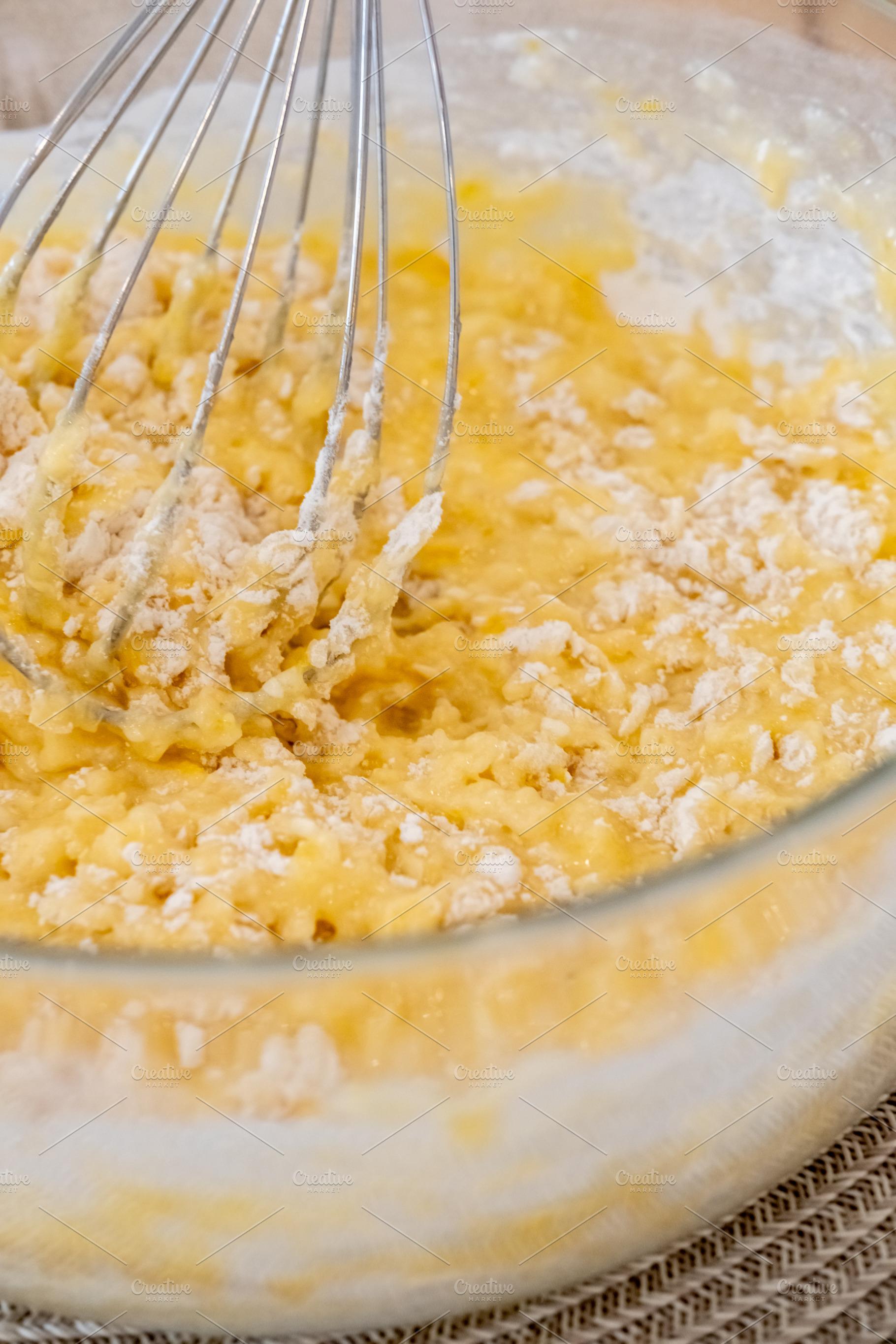 Culinary work whisking dough yellow liquid bowl, a Food & Drink Photo by Photo Drive Studio