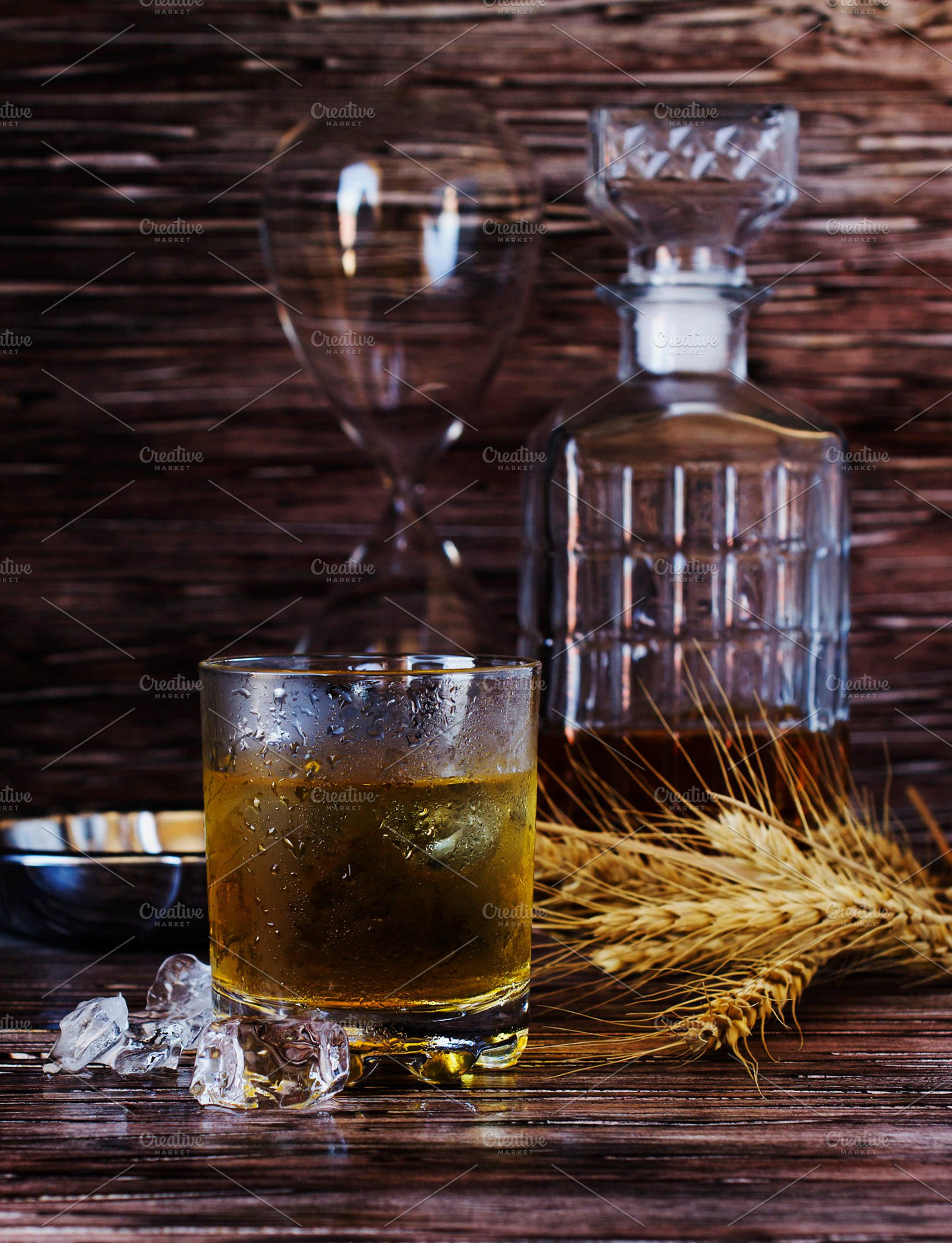 Glass of whiskey with ice an ashtray and a decanter containing whiskey, a Food & Drink Photo by Wild Drago Shop