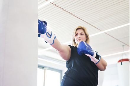 Overweight woman is working out in, a Sports & Recreation Photo by HalfPoint