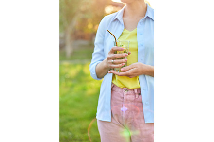 Woman drinking summer citrus, a Food & Drink Photo by IlliaBondarPhotography