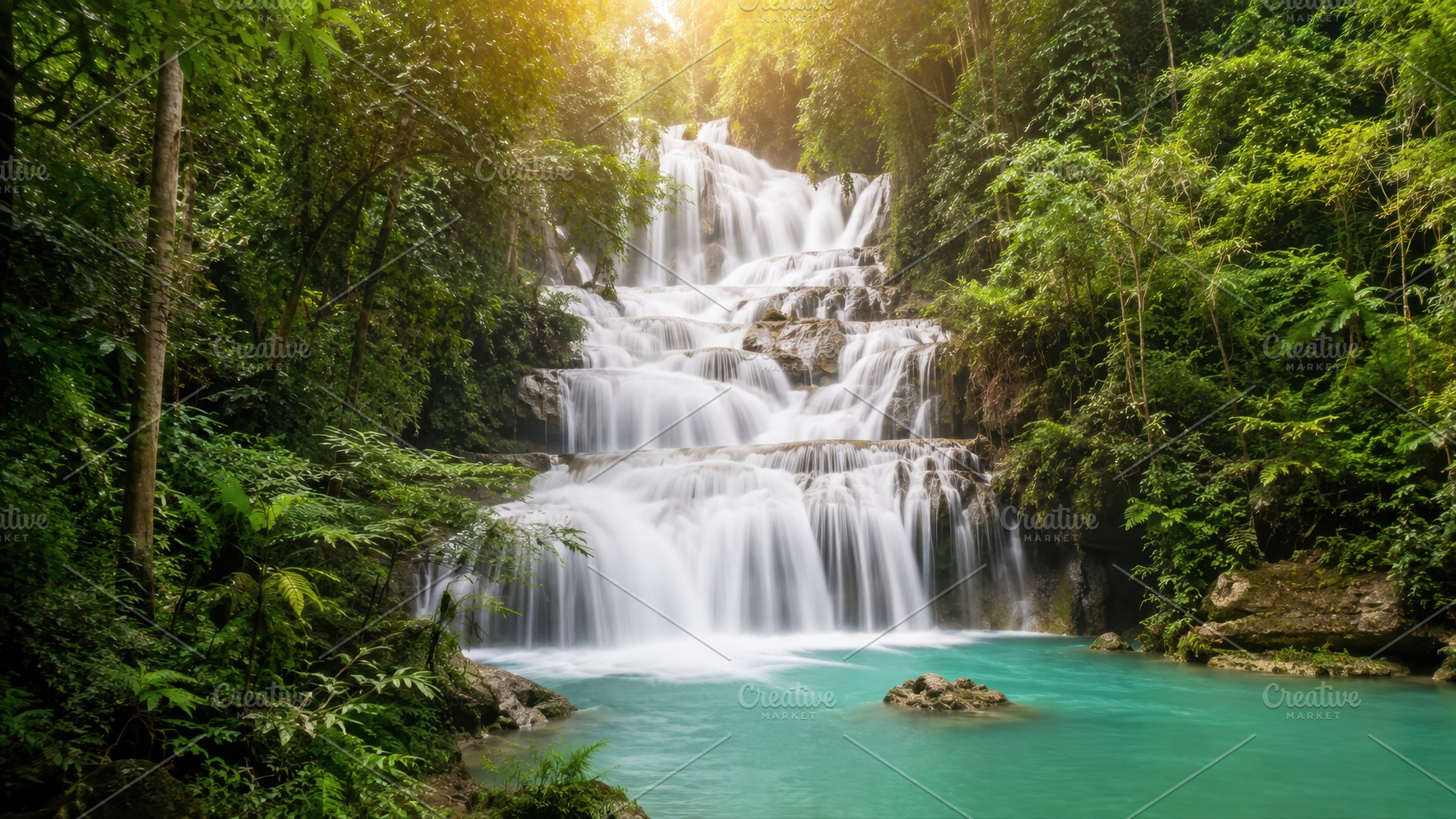 Waterfall cascades in green forest, a Photo by Beautiful things