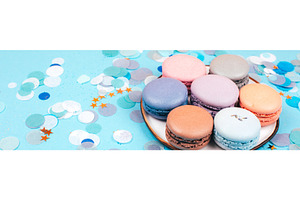 Plate of pastel macarons with, a Food & Drink Photo by Anna Efetova