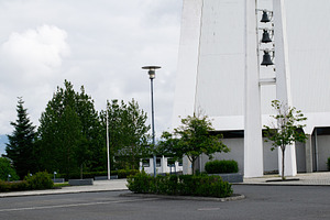 Modern church architecture in Reykjavik with nature and minimalist urban design, a Photo by AS photostudio