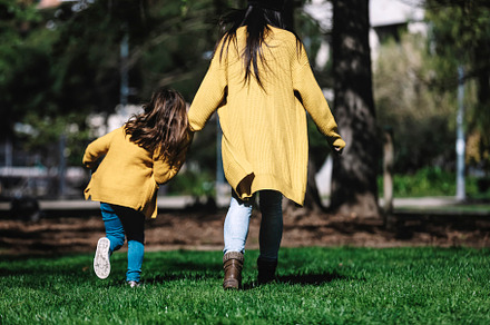 Rear view of a mother with her baby. Mom and daughter in an autumn park, a Person Photo by 2Design