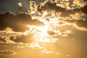 Sunset sky with clouds and sun