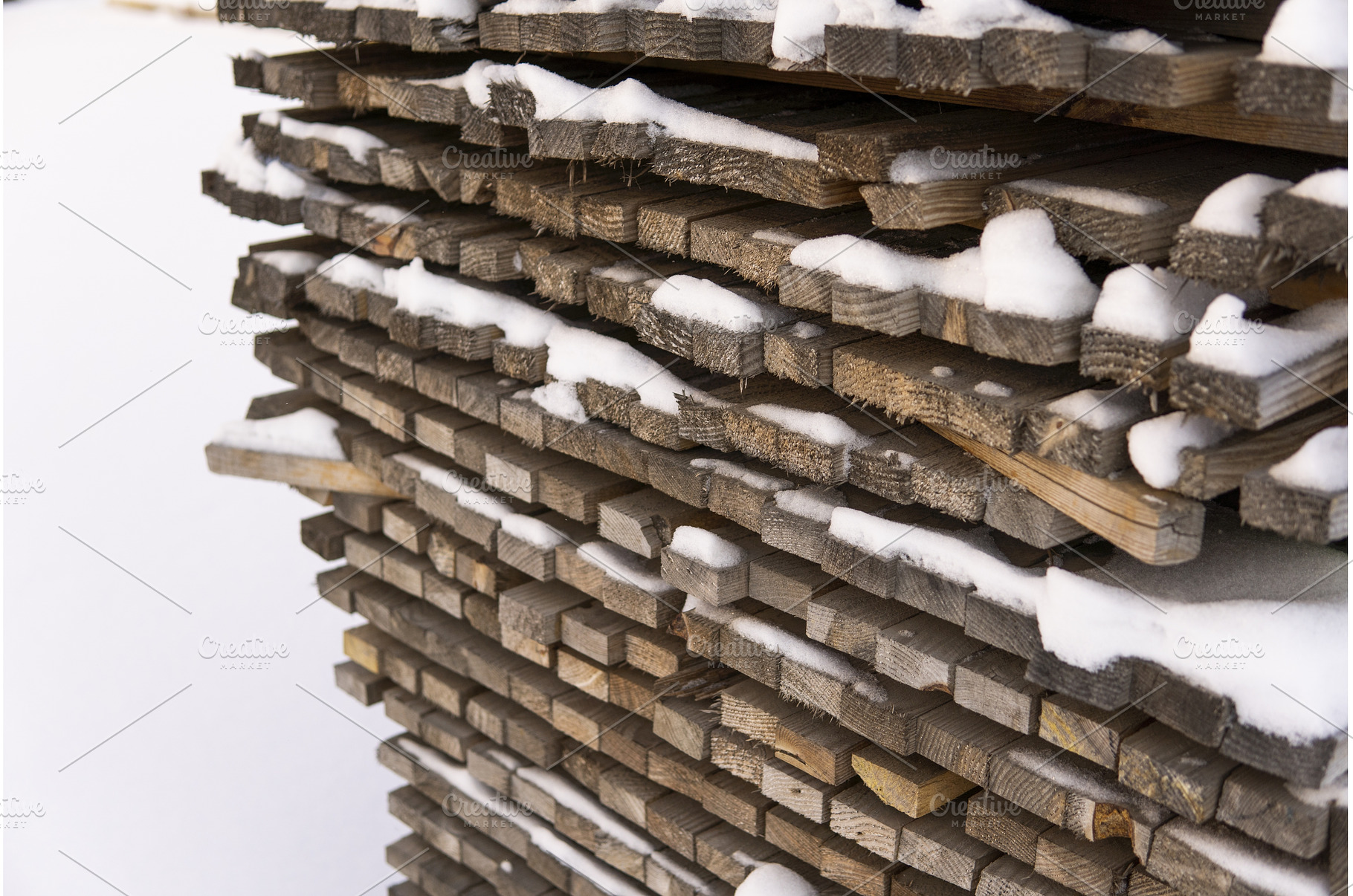 Stacked lumber planks covered in, a Background Photo by volodymyrshtun13795