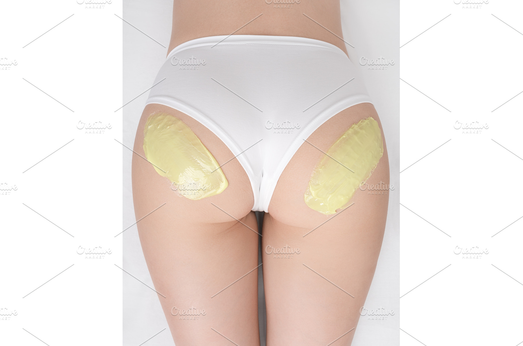 Top view green hot wax on buttocks, a Beauty & Fashion Photo by Alexander-Piragis