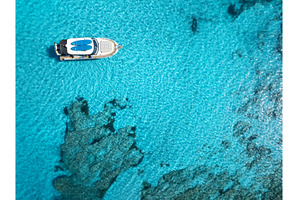 Aerial view of yacht in clear, a Nature Photo by den-belitsky