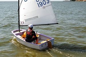 Young child sailing Optimist boat, a Sports & Recreation Photo by BOOCYS