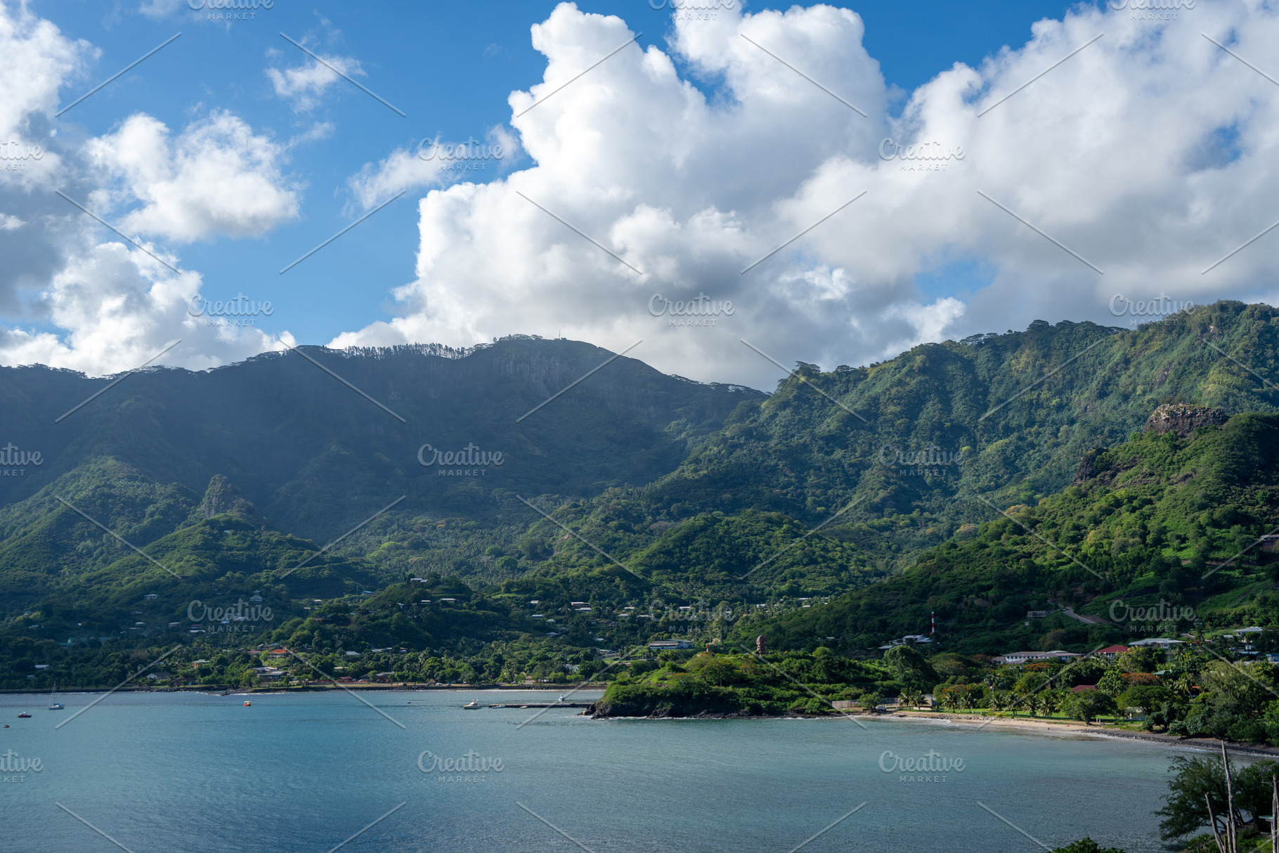 Taiohae Bay and town with anchored sailboats in Nuku Hiva, Marqu, a Photo by GoodGoods