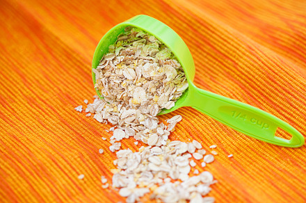 oatmeal in a volumetric spoon on a napkin Orange, a Food & Drink Photo by Artsaba Family
