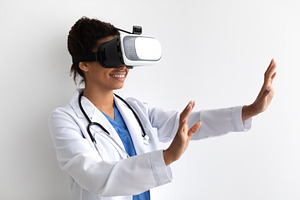 Black Doctor Using Virtual Reality Headset For Medical Purposes, a Photo by Prostock-Studio