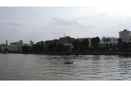 Boat with people on river in center, a Transportation Photo by Media Whale Stock
