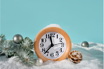 Wood alarm clock with fir twigs, a Holiday Photo by tilialucida