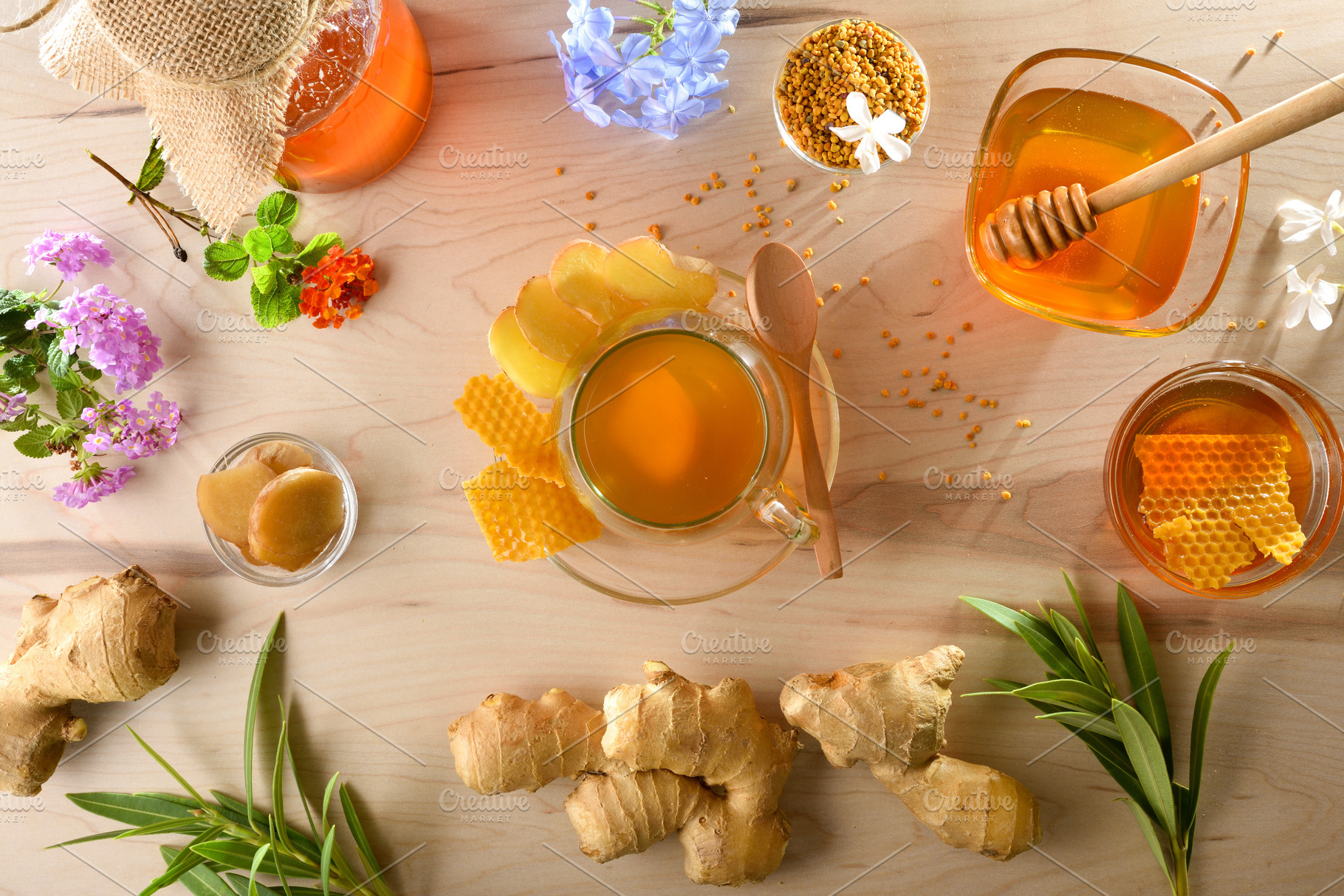 Ginger and honey infusion on wooden table with products around, a Food & Drink Photo by Davizro's Market