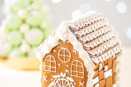 Christmas gingerbread house featuring house, gingerbread, and background