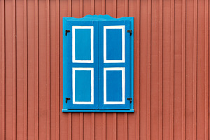 Building with closed window shutters, an Architecture Photo by BOOCYS